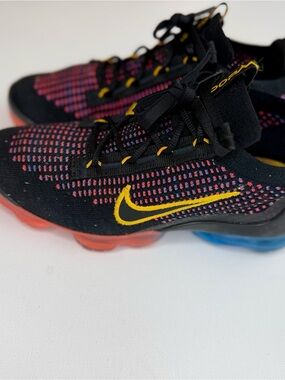 Nike Kids Black Knit Sneakers with Pink Accents and Yellow Swoosh
